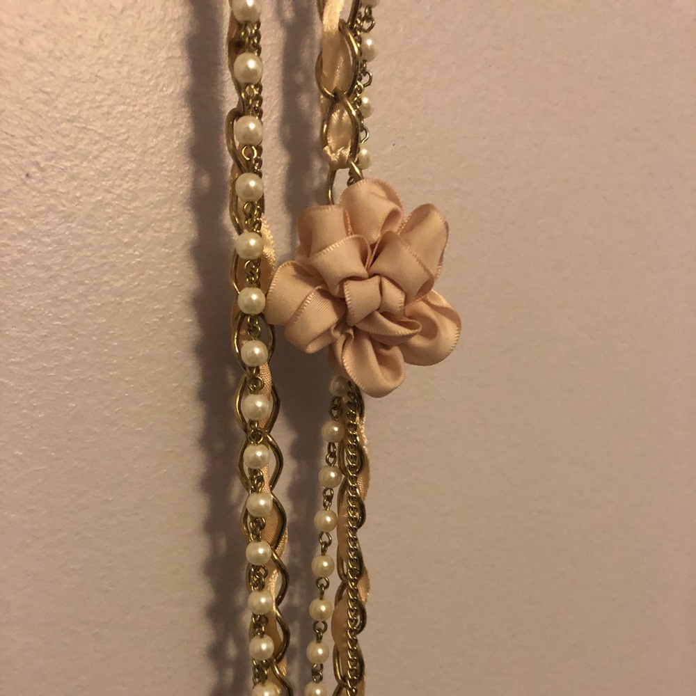 Long Gold Necklace with Bow and Pearl Design